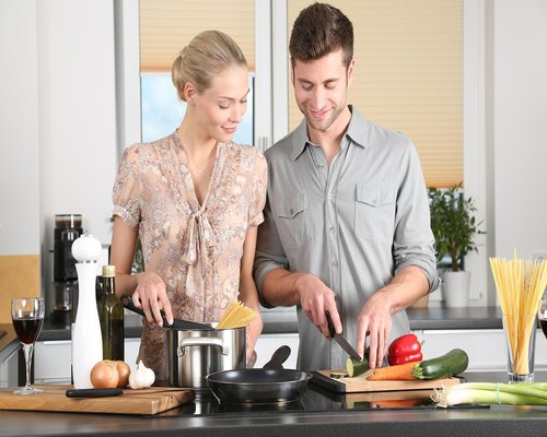 Happy family cooking together in kitchen