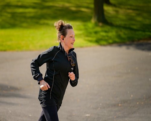 Woman jogging in park outdoors